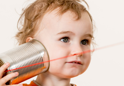 child using a string phone