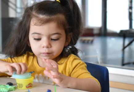 girl playing with play-doh