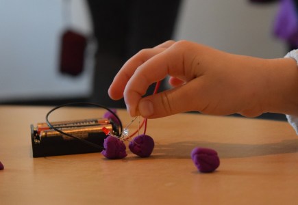 child creating electricity