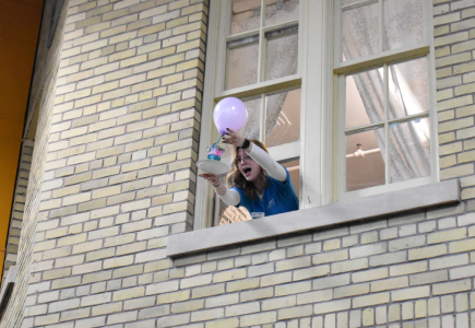 staff member dropping an egg from a window