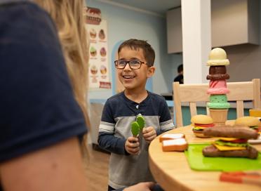 Child plays in Community Roots