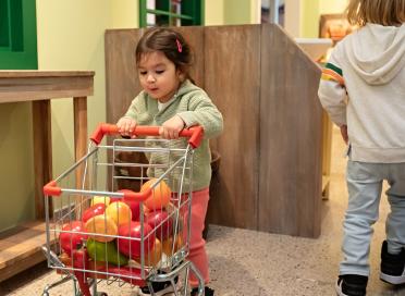 toddler in community roots exhibit
