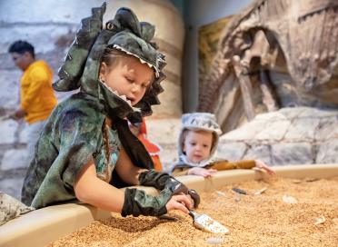 child in costume in unearthed exhibit