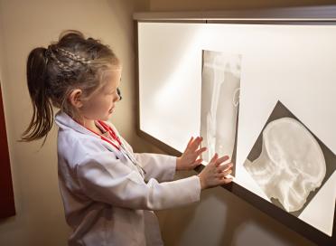 Child looks at x-rays